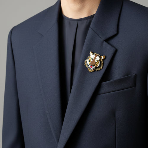 Tiger print brooch with a layered dimensional face design on a black men's suit