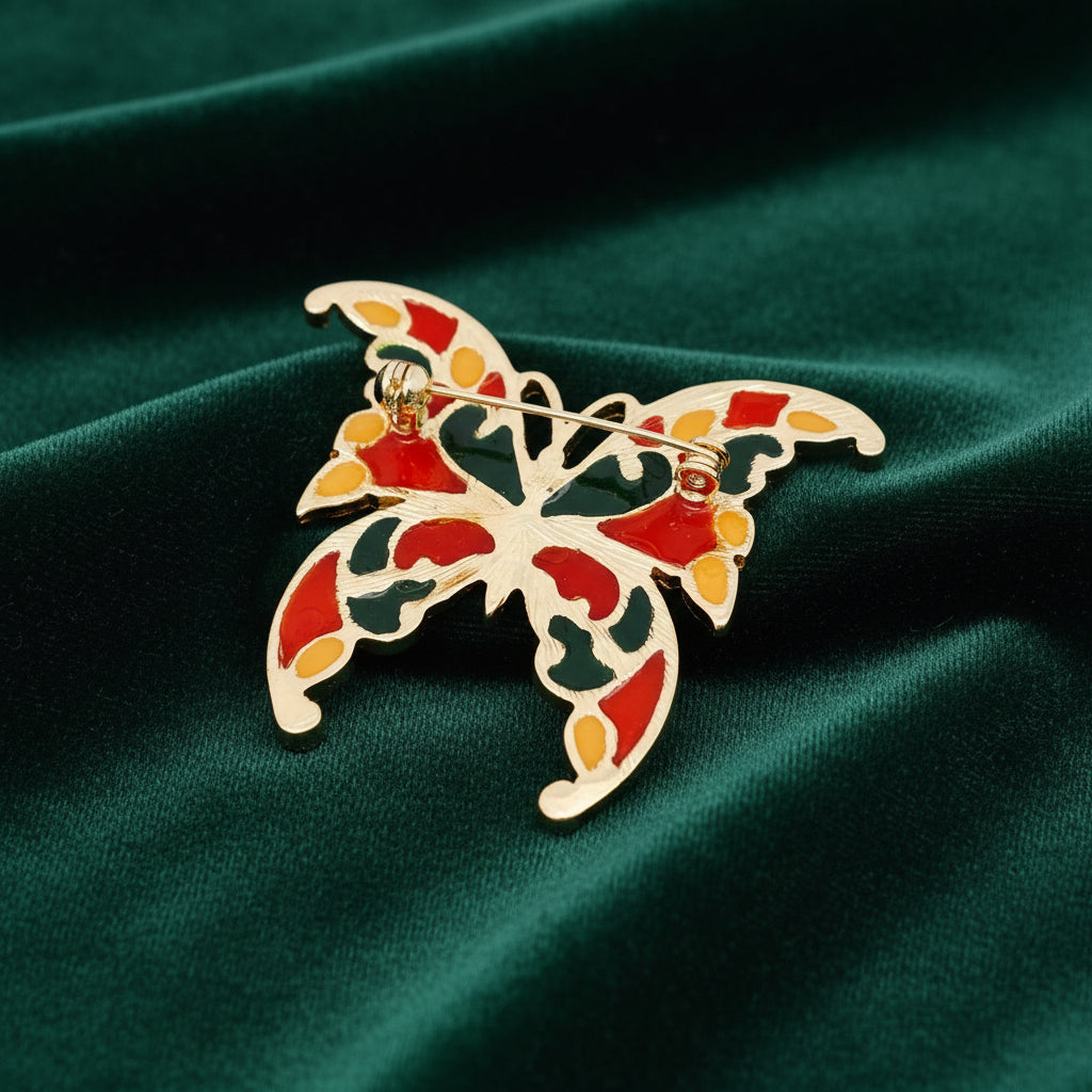 Back view of butterfly-shaped brooch with colorful design, showing clasp mechanism