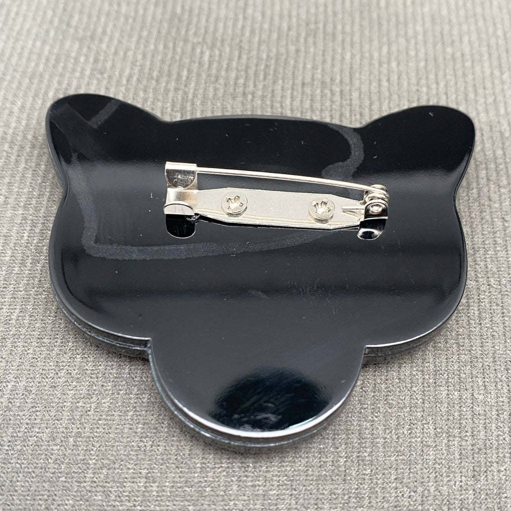 Back view of black panther head-shaped brooch showing the clasp mechanism