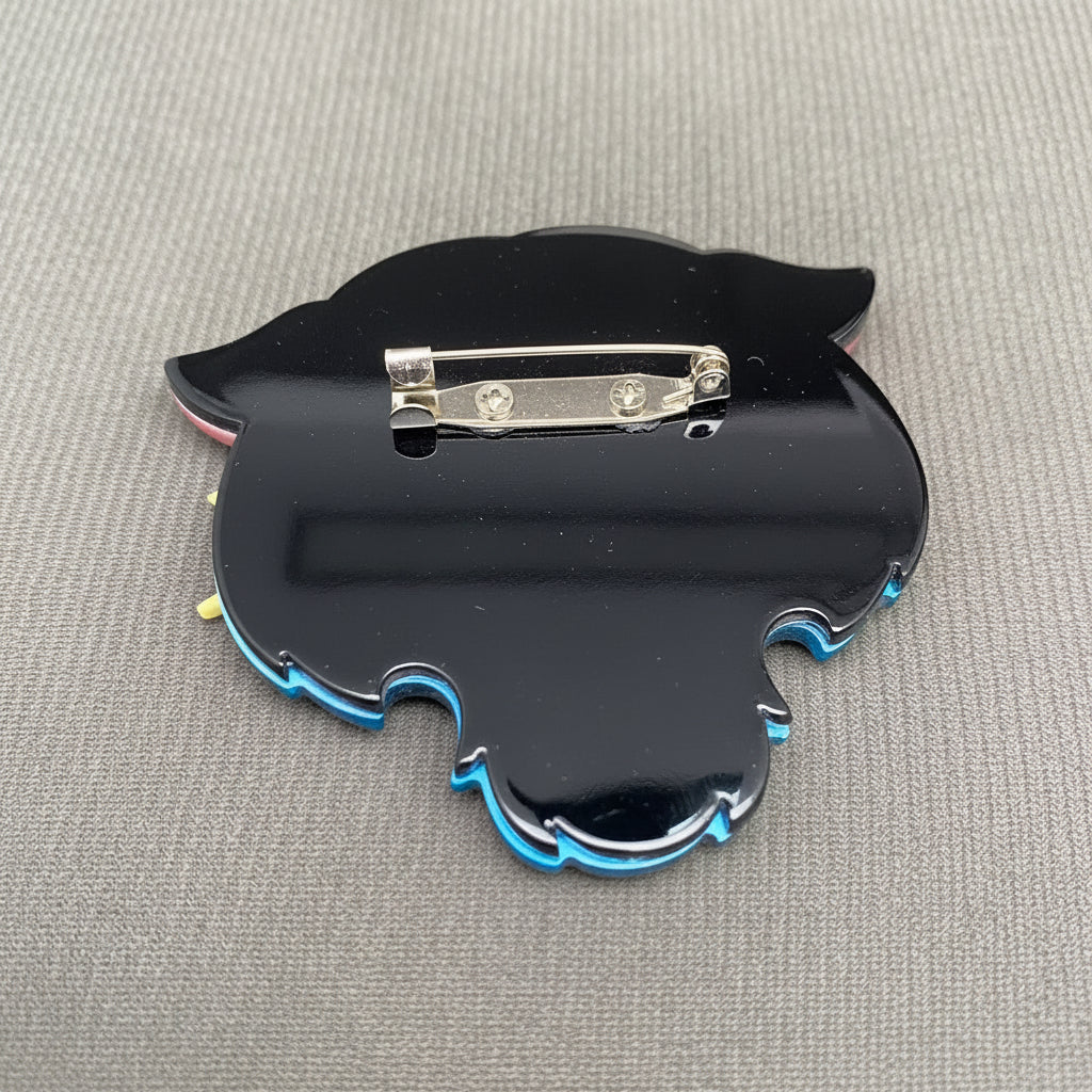Back view of acrylic tiger head brooch showing the clasp mechanism