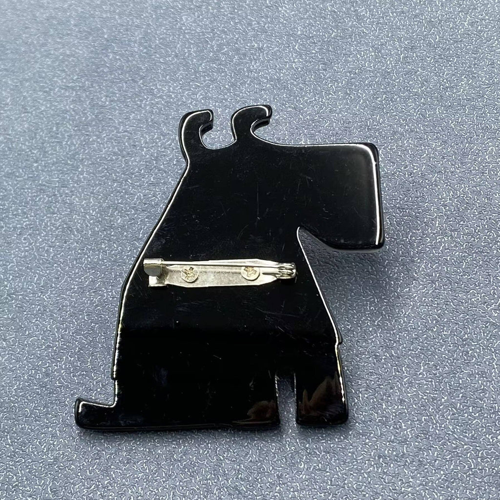 Back view of the dog-shaped brooch showing the clasp mechanism