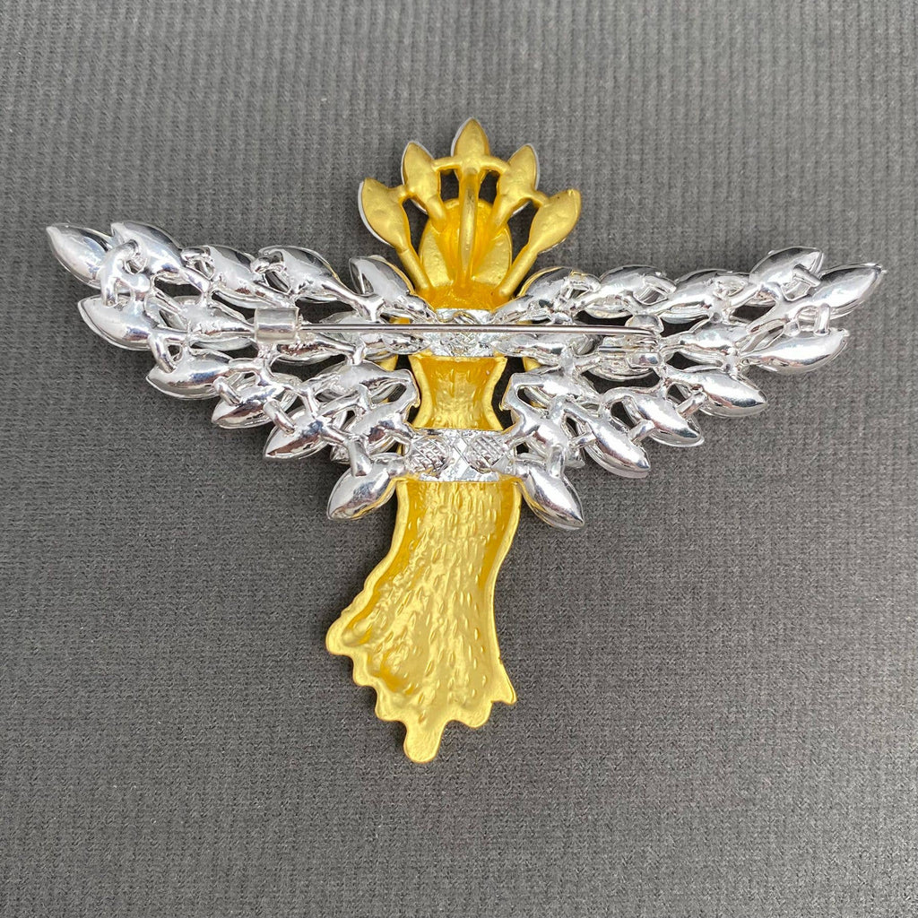 Back view of gold angel brooch with crystal wings, showing the clasp mechanism
