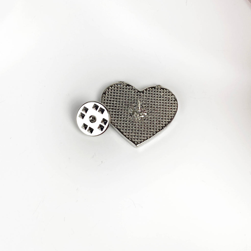 Back view of heart-shaped earth pin showing pin clasp 