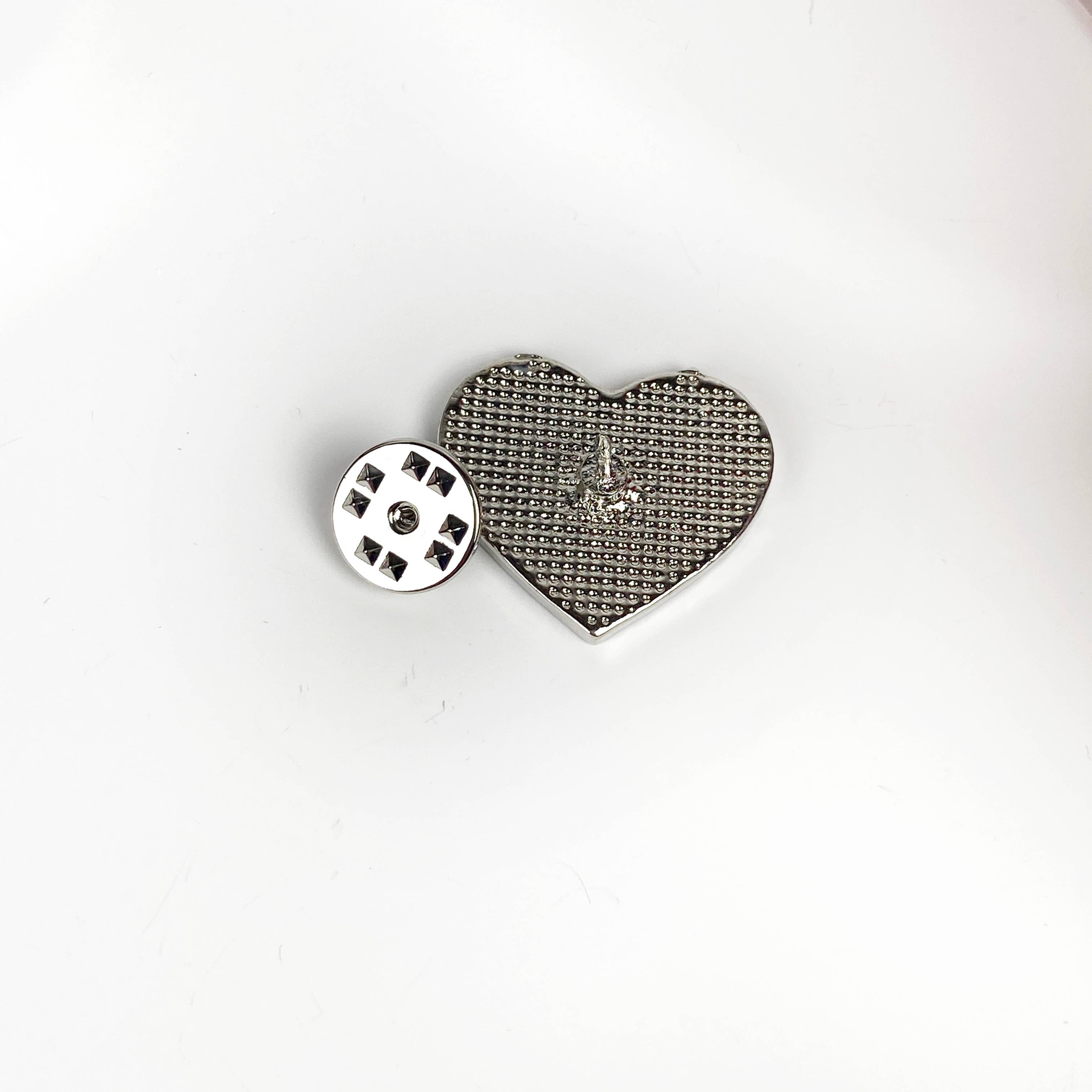 Back view of heart-shaped earth pin showing pin clasp 