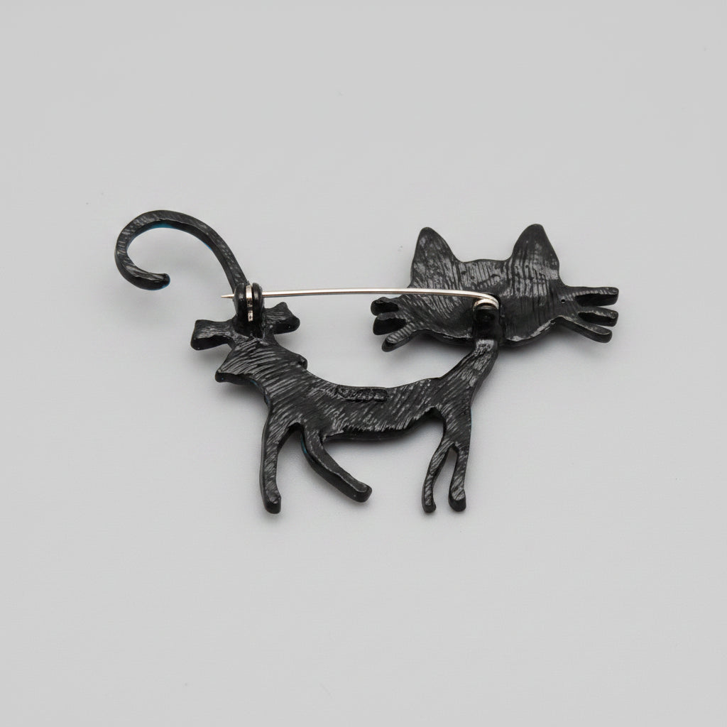 Back view of colorful cat-shaped brooch showing the clasp mechanism