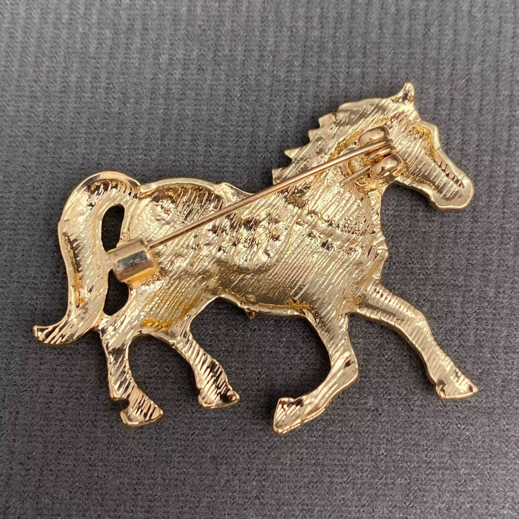 Back view of horse-shaped brooch, showing the clasp mechanism