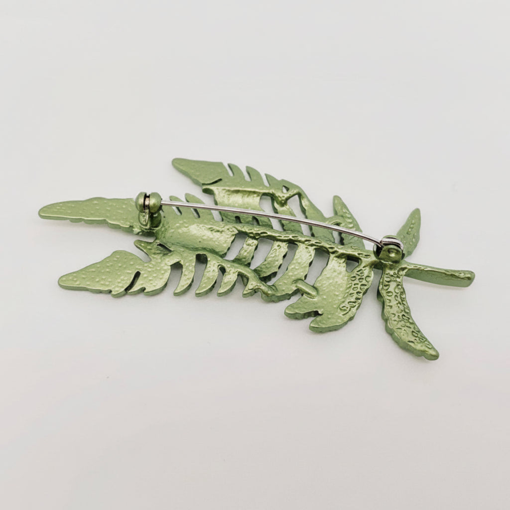 Back view of fern leaf shape plant brooch showing clasp mechanism