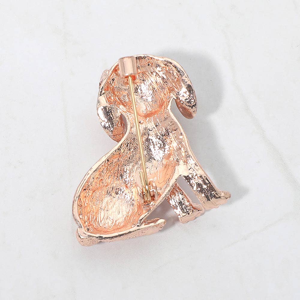 Back view of gold dog shaped brooch showing clasp and hinge mechanism