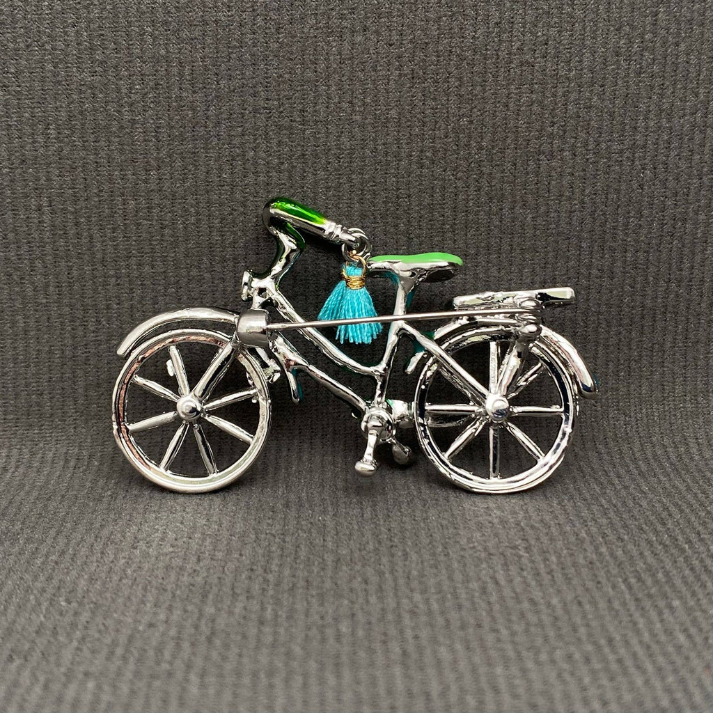 Back view of bicycle-shaped brooch showing clasp and hinge mechanism