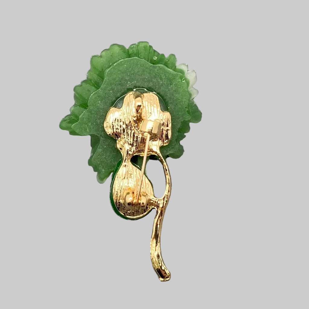 Back view of green jade flower brooch showing the clasp mechanism