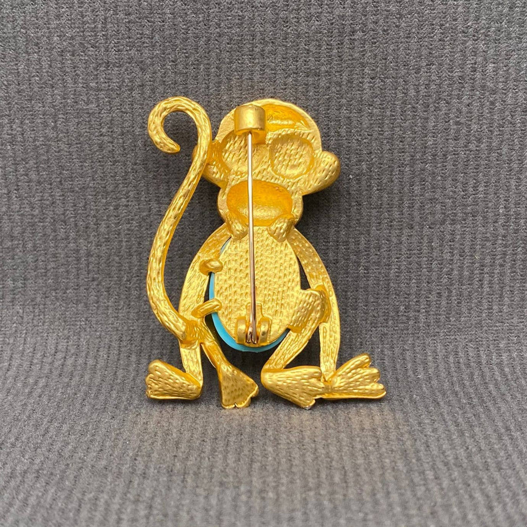 Back view of jelly belly golden monkey brooch showing the clasp mechanism