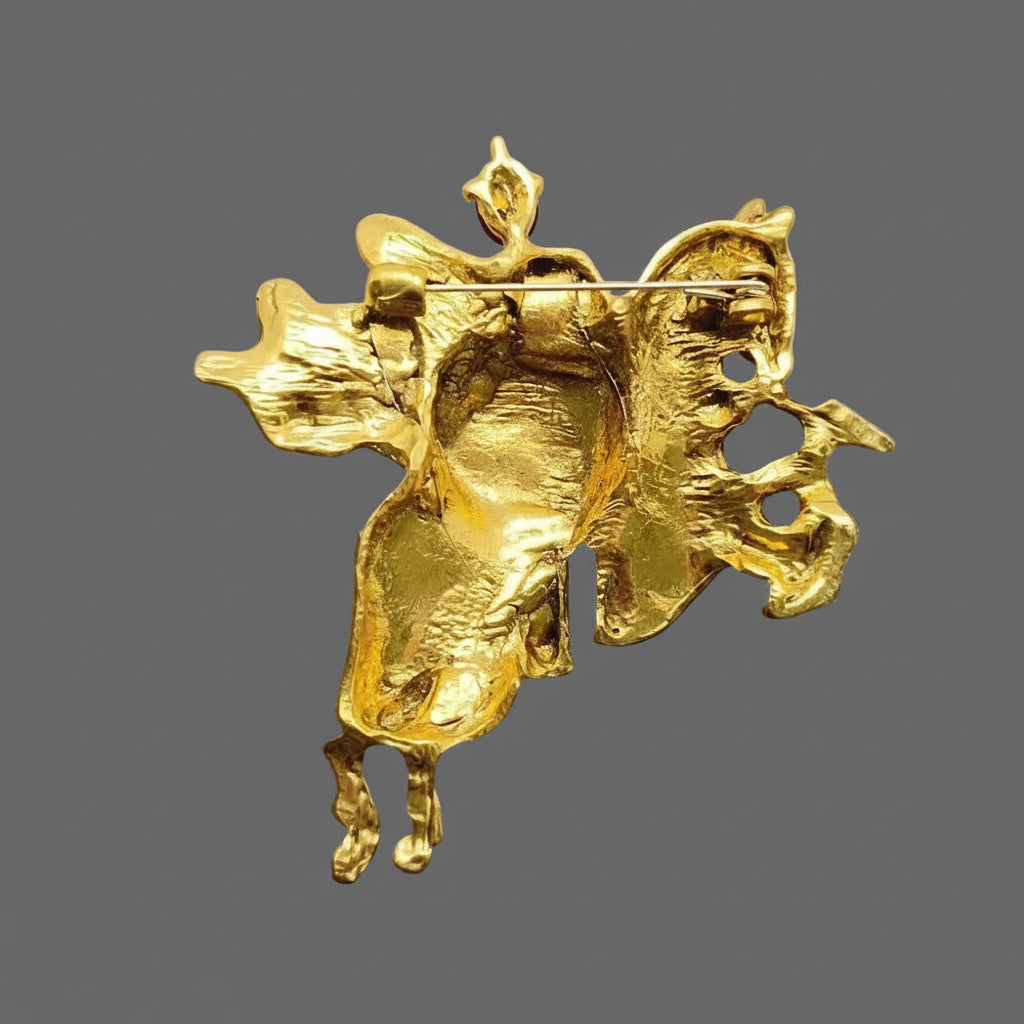 Back view of jousting knight on horse brooch showing clasp and hinge mechanism