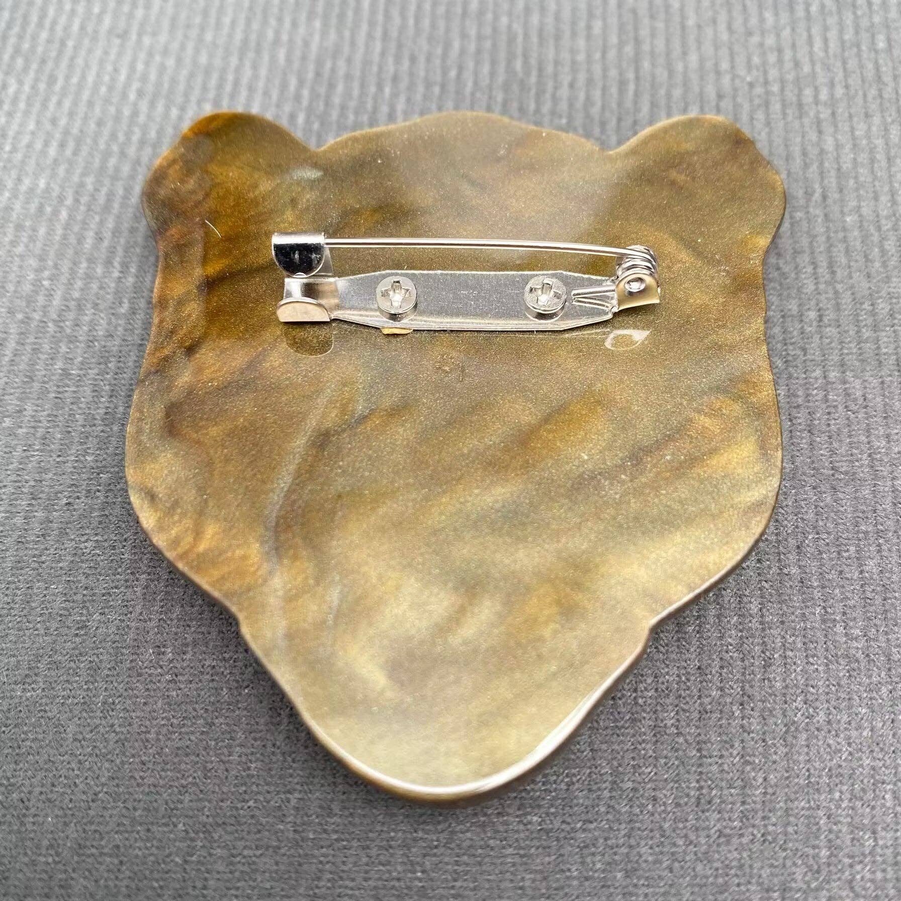 Back view of leopard head design brooch showing the clasp mechanism