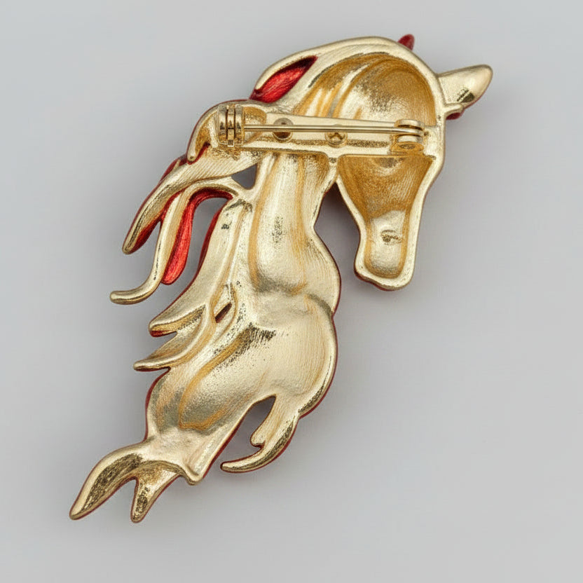 Back view of horse-shaped brooch with gemstones, showing clasp mechanism