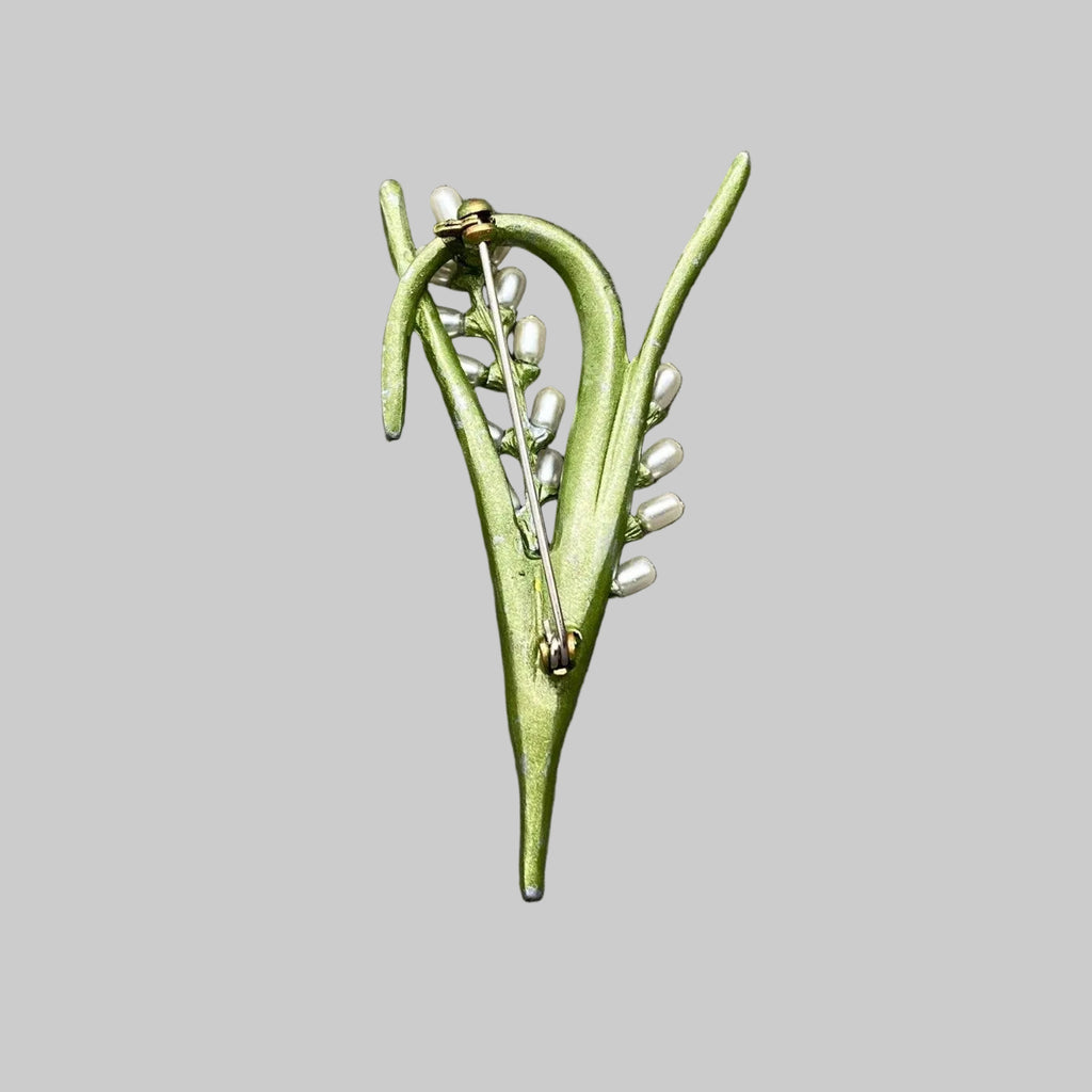 Back view of green enamel rice plant brooch with pearl accents, showing the clasp mechanism