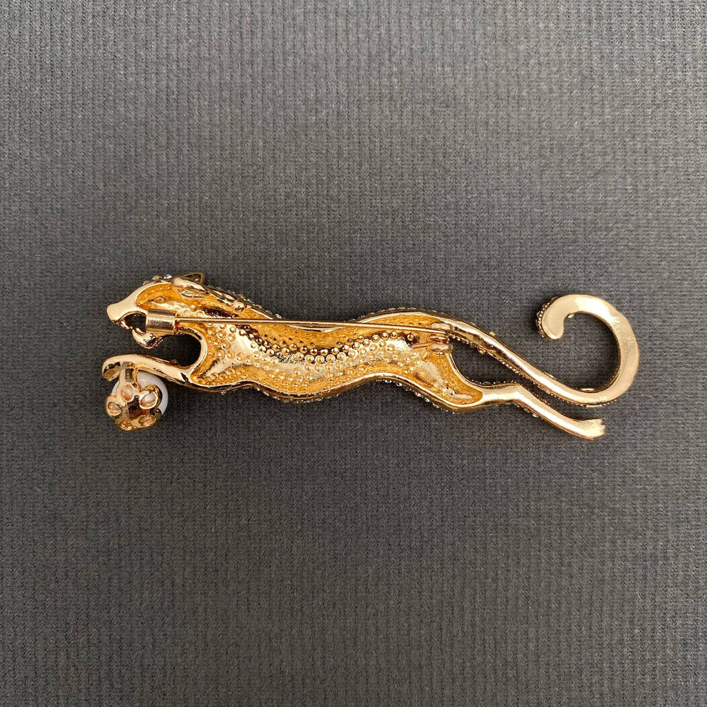 Back view of cheetah shaped brooch showing clasp and hinge mechanism