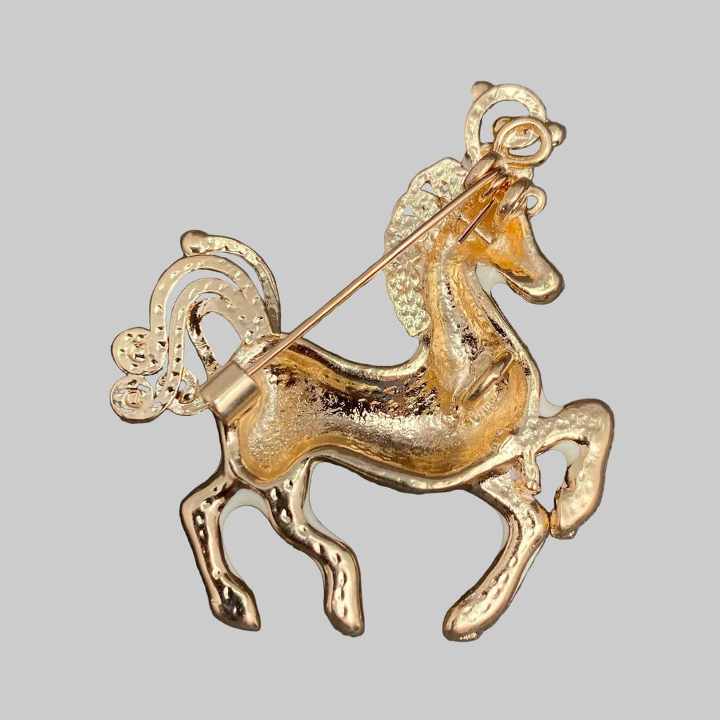 Back view of decorative horse brooch showing the clasp mechanism
