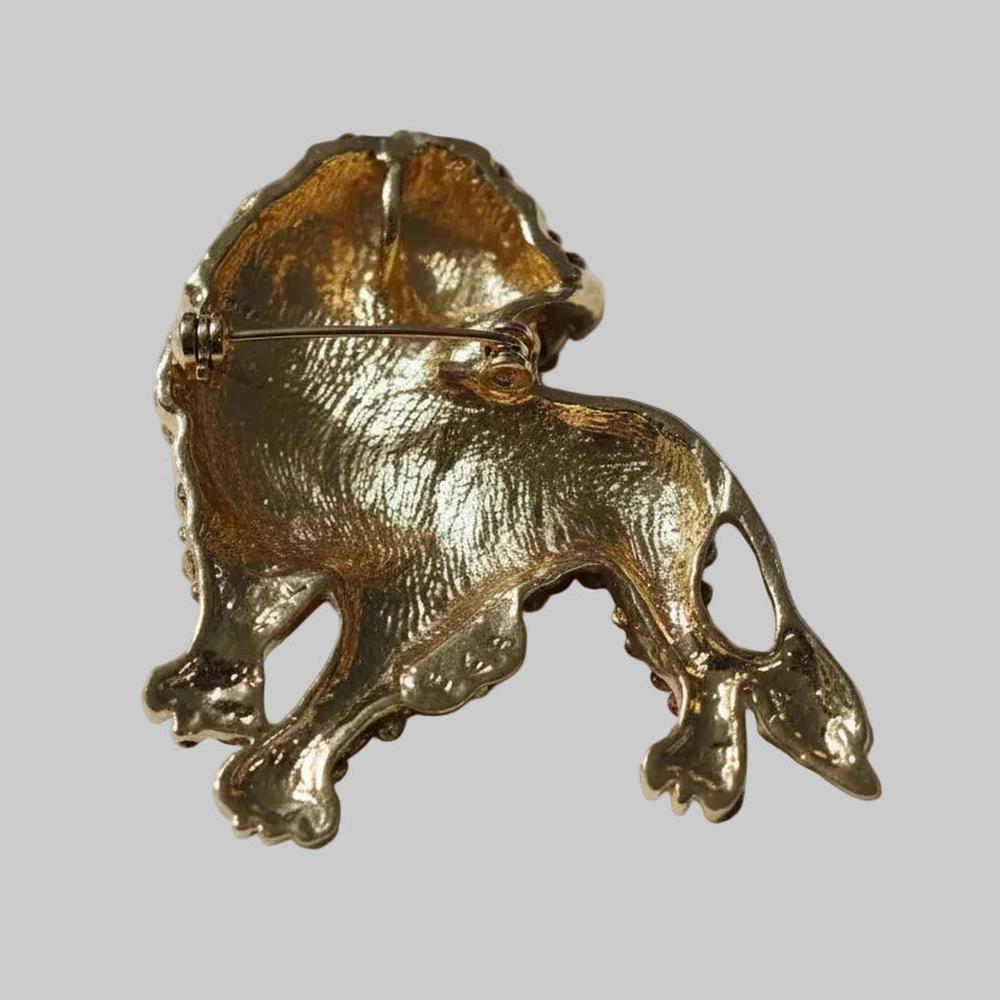 Back view of lion shaped brooch showing clasp and hinge mechanism