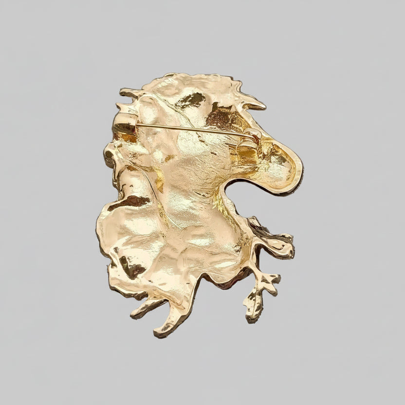 Back view of decorative zebra brooch with flowers, showing the clasp mechanism
