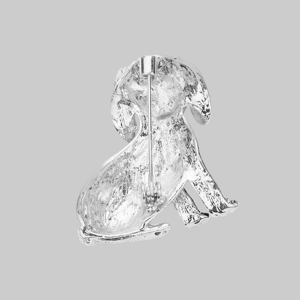 Back view of silver dog shaped brooch showing clasp and hinge mechanism