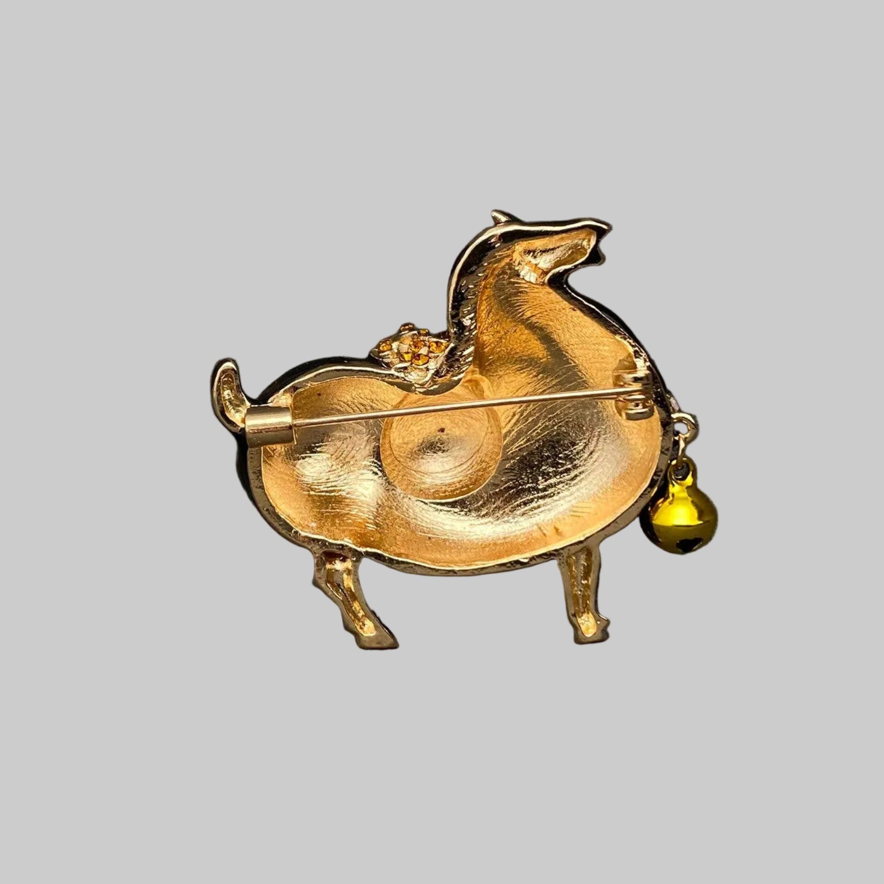 Back view of Tang Dynasty-style horse brooch showing the clasp mechanism