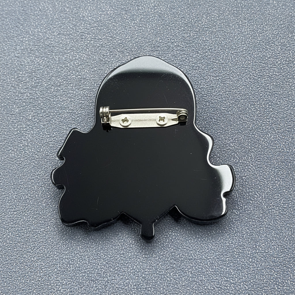 Back view of a gypsy girl acrylic brooch showing the clasp mechanism