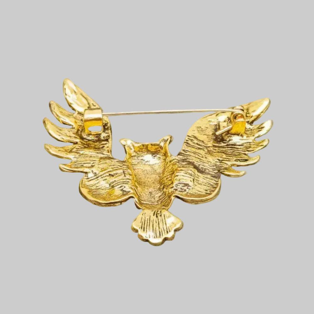 Back view of owl brooch pin showing the clasp and hinge mechanism
