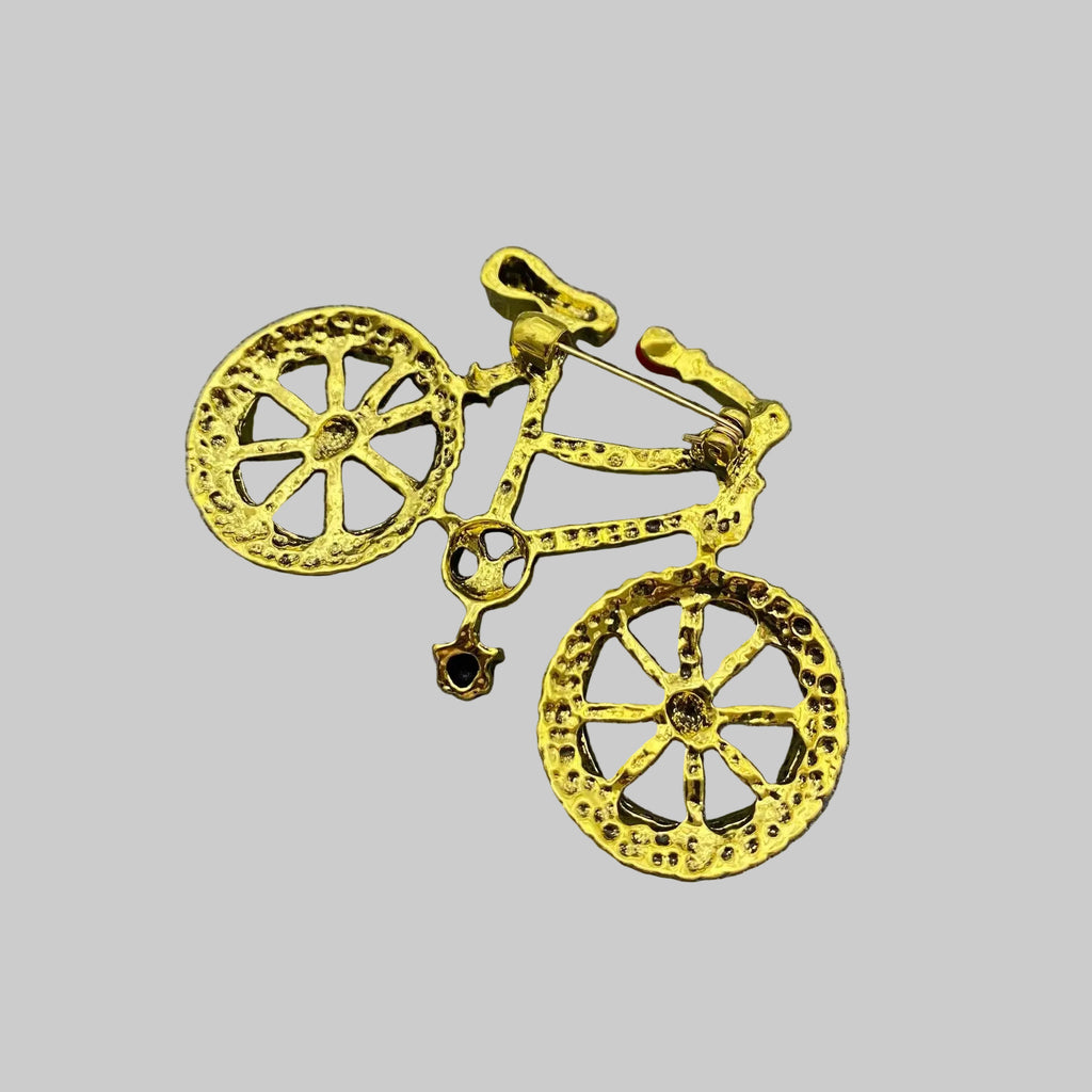 Back view of bicycle shaped brooch showing the clasp mechanism