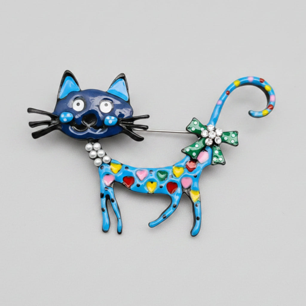 Colorful cat-shaped brooch on a gray background