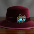 Blue rhinestone swan brooch pinned on a red hat