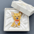 Dog-shaped brooch with a red collar in a white gift box