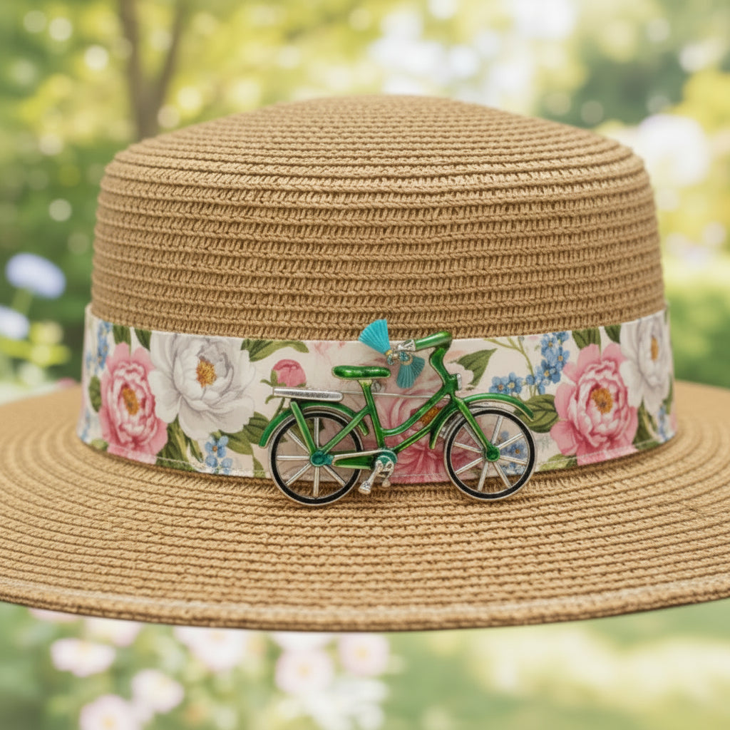 Green enamel bicycle-shaped brooch with blue tassel handle bars