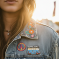 Hippie-themed lapel pin with a van and 'Hippie Soul' text, pinned on a denim jacket