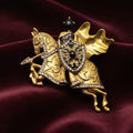 Jousting knight on horse brooch with carved golden metal accents and rhinestone detailing