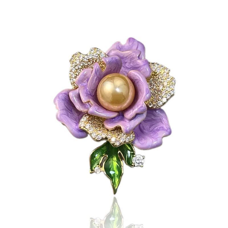 Lavender flower-shaped brooch with a pearl center on a white background