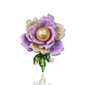 Lavender flower-shaped brooch with a pearl center on a white background