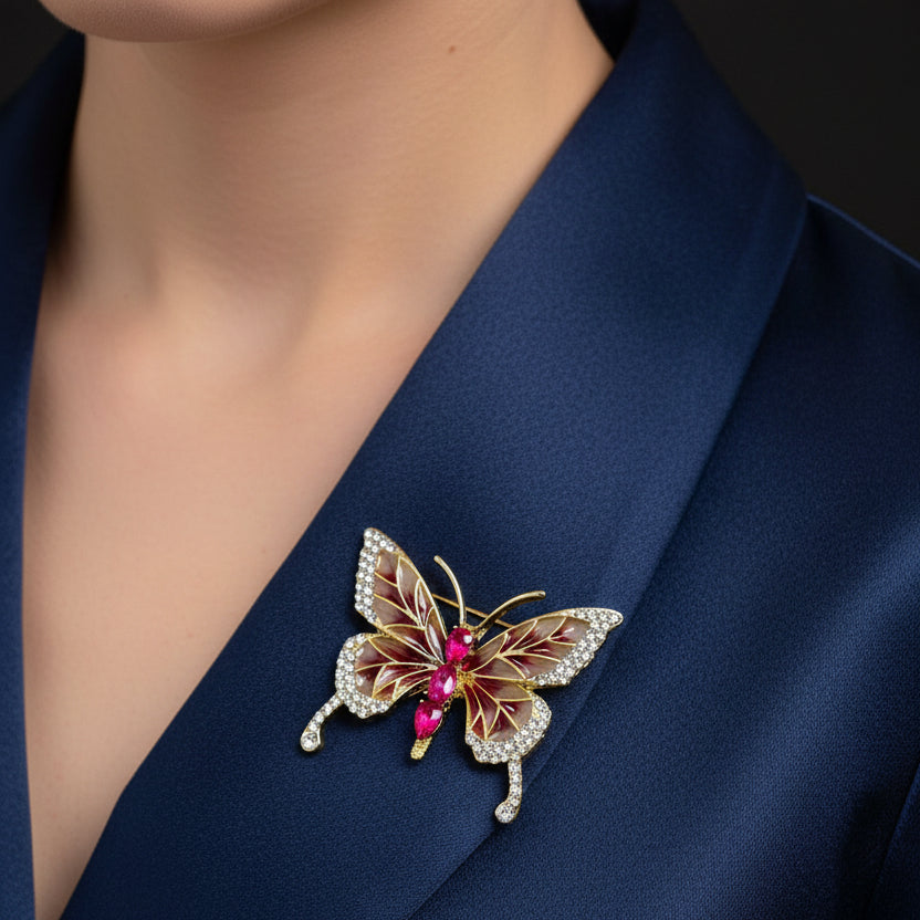 Butterfly-shaped brooch with gemstones on a dark background