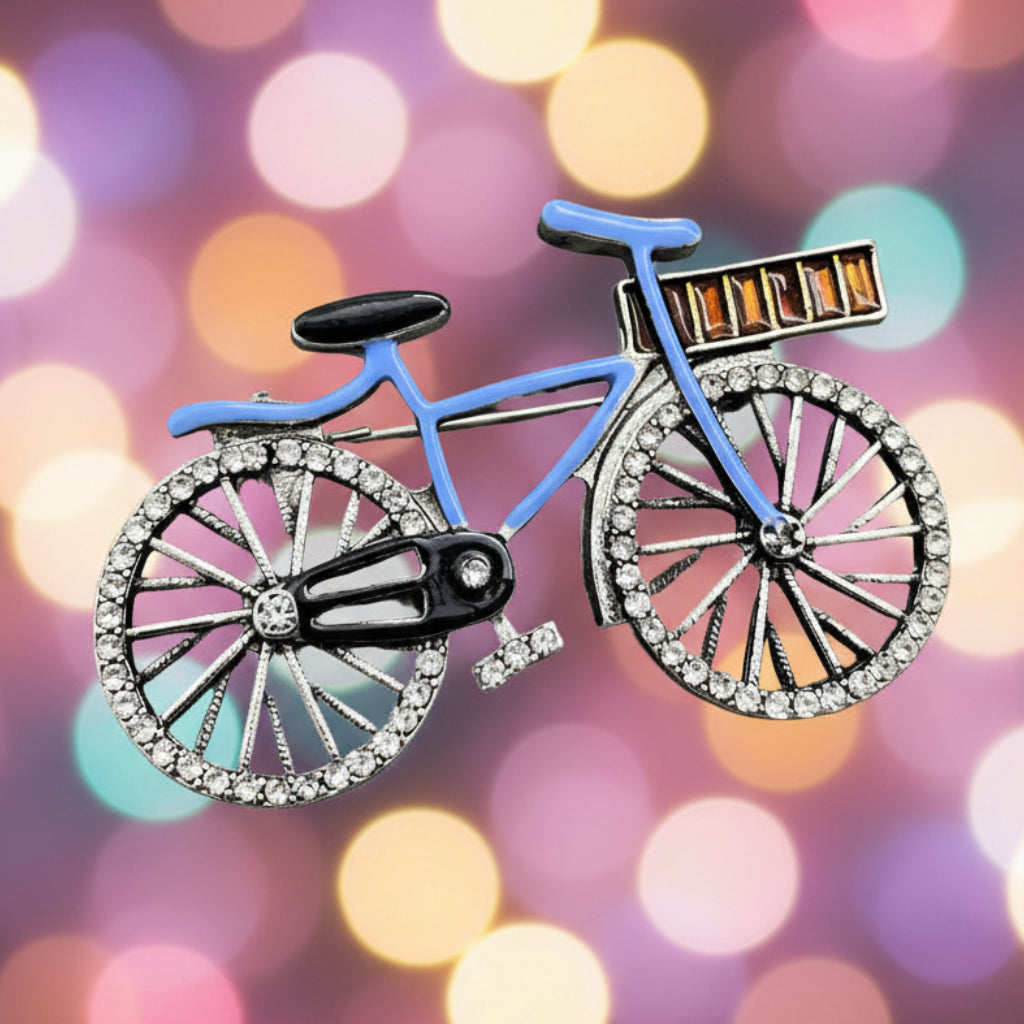Bicycle-shaped brooch with blue frame and black wheels on a colorful background