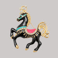 Decorative horse brooch with black body, gold accents, and colorful elements on a gray background