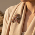 Dimensional lion shaped brooch finished with sparkling pave' set rhinestones and golden accents