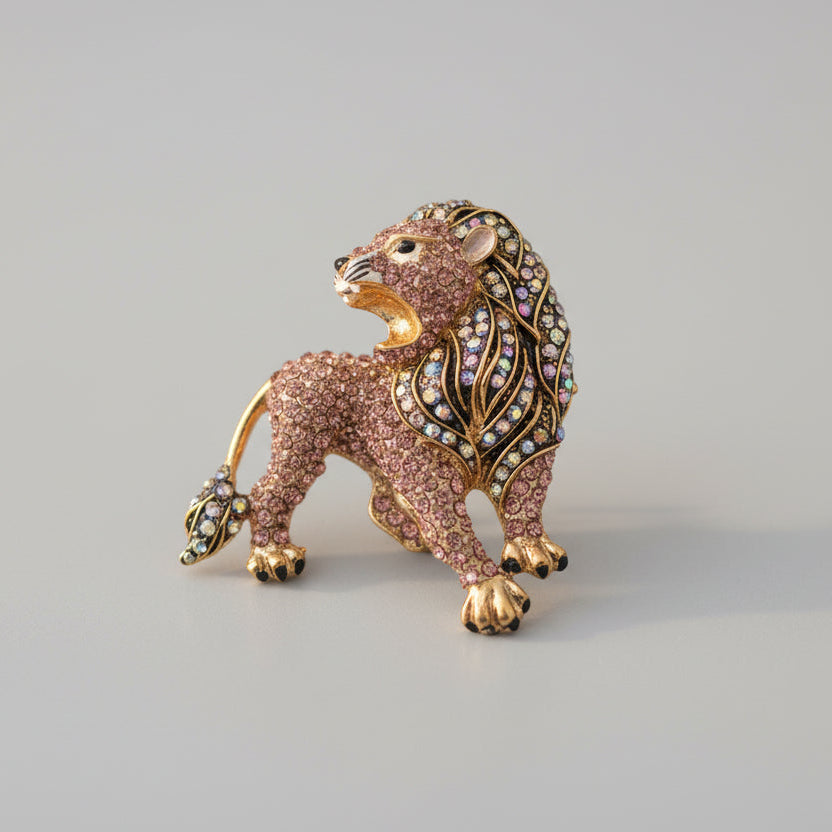 Dimensional lion shaped brooch finished with sparkling pave' set rhinestones and golden accents