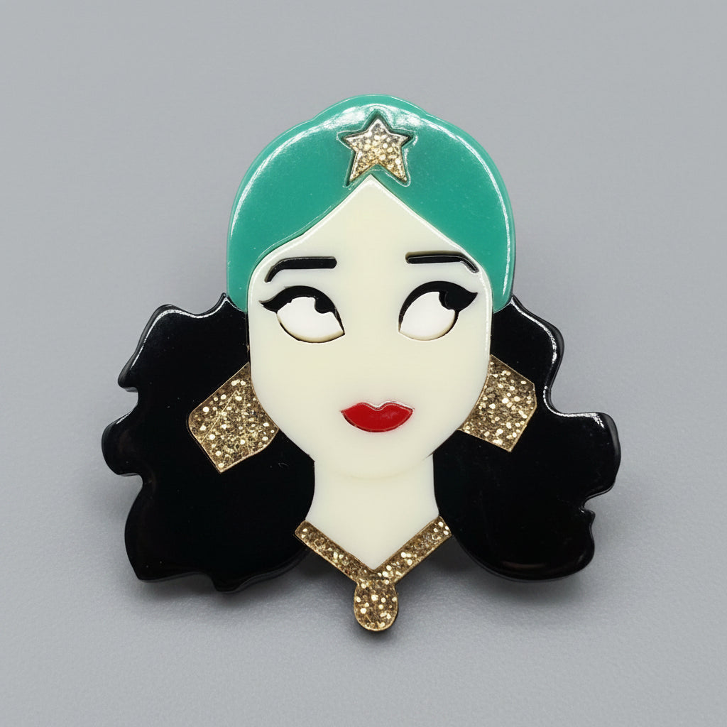 Gypsy girl acrylic brooch against a soft gray background
