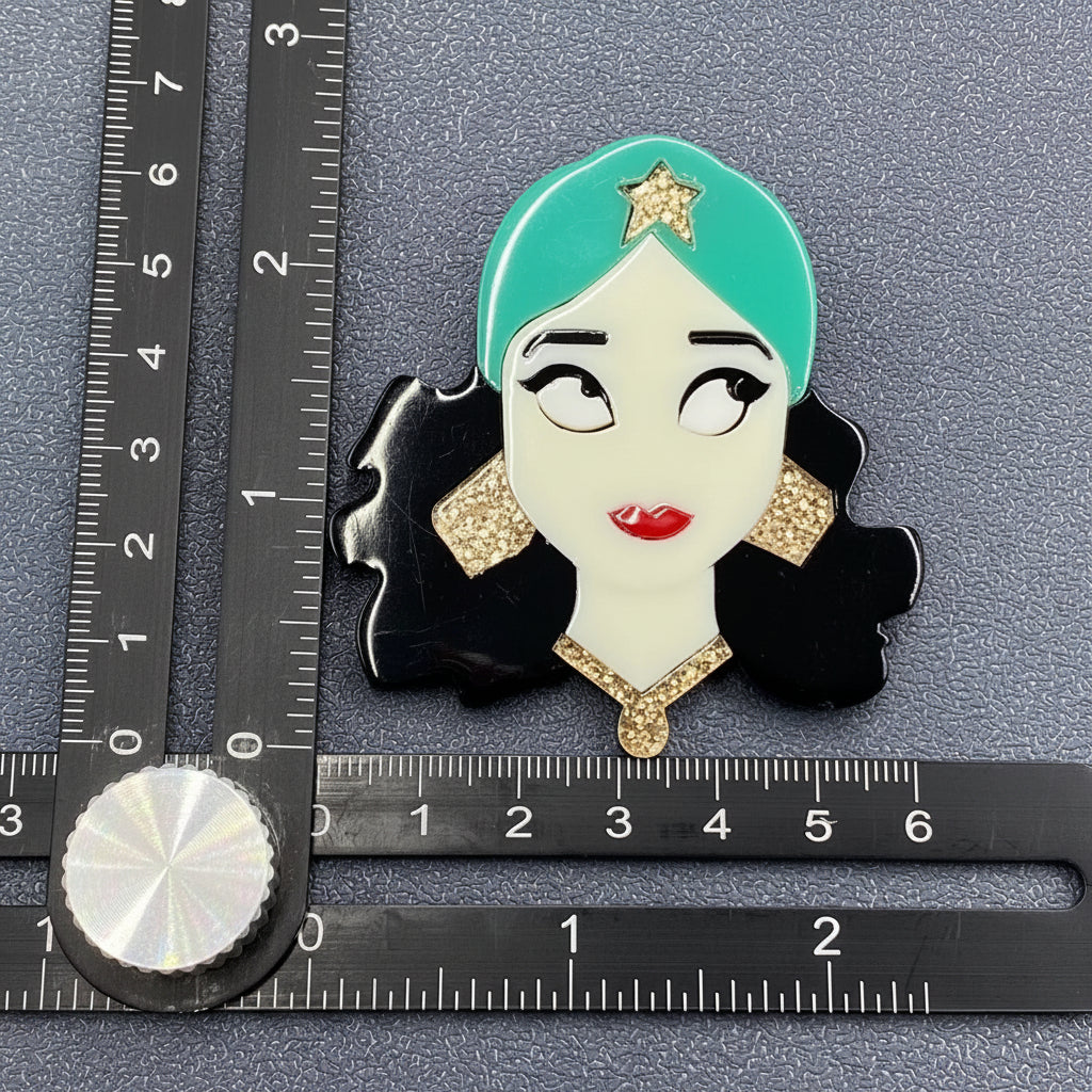 Gypsy girl acrylic brooch against a soft gray background