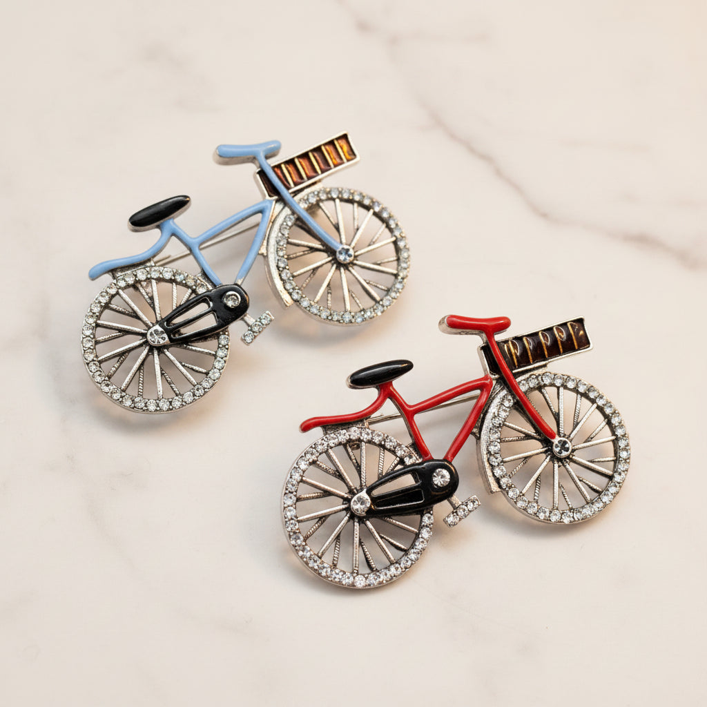 Two bicycle-shaped pins, one blue and one red, on a white background