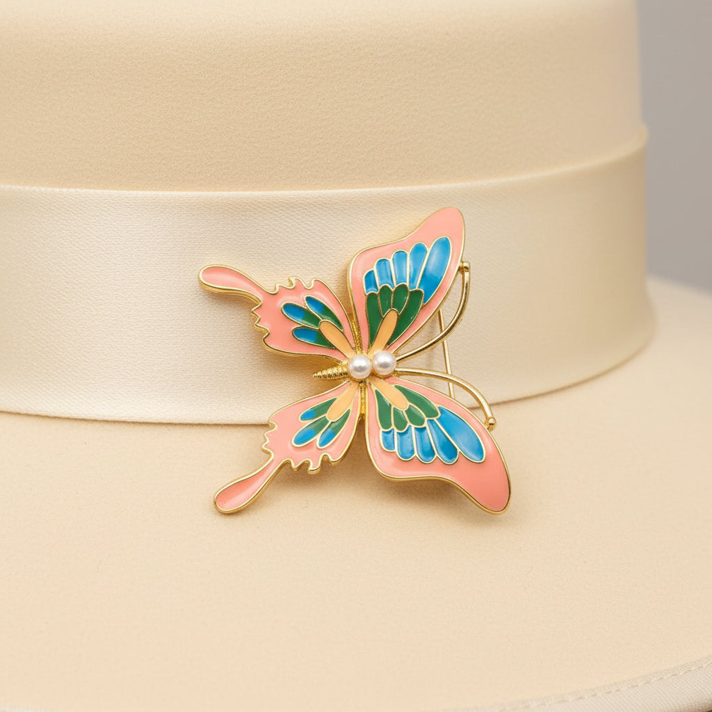 Butterfly-shaped brooch with pink, blue, and green wings on a white background